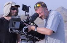 The team filming in Bagram, Afghanistan, with security